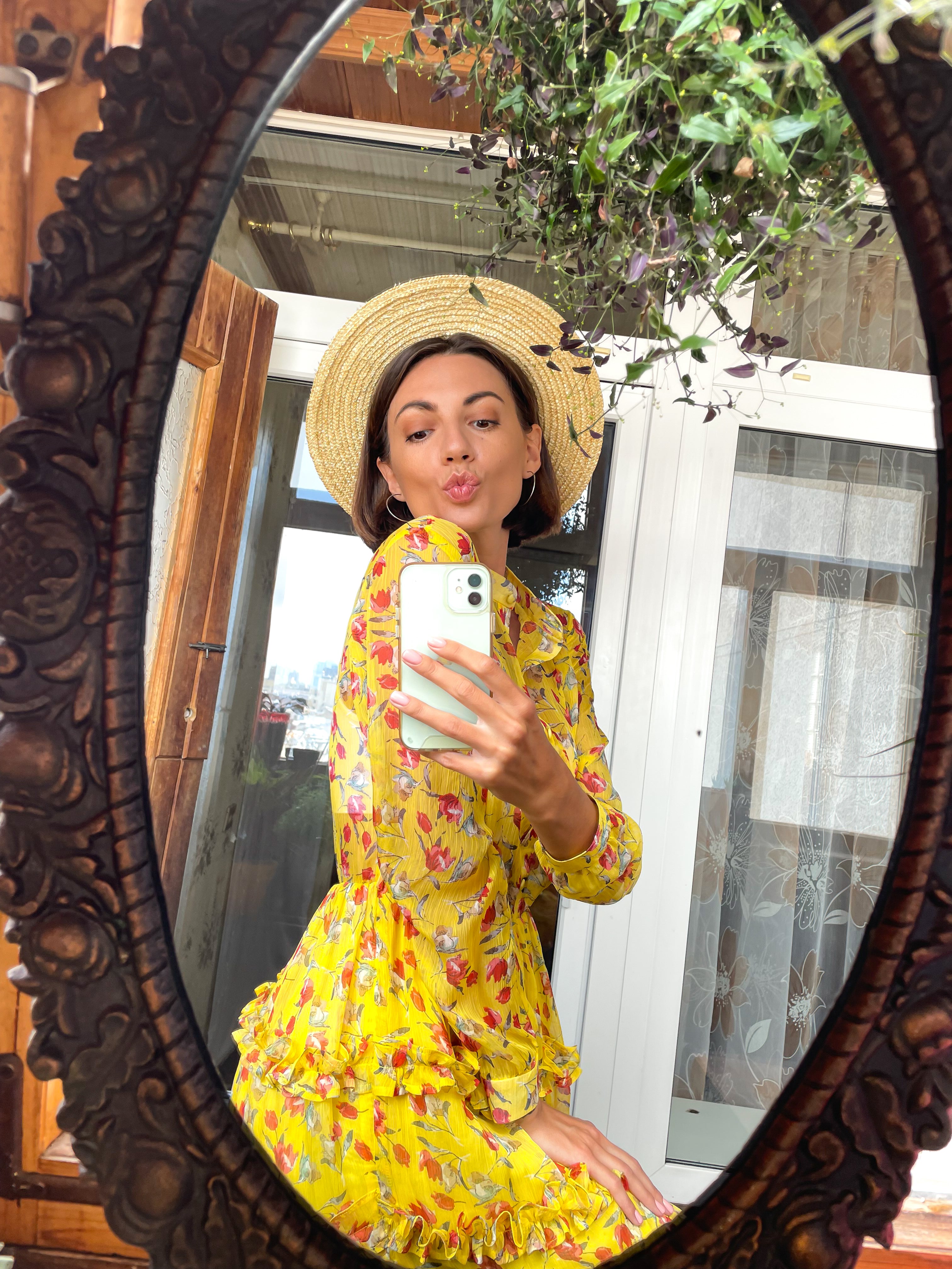 files/pretty-woman-home-takes-photo-selfie-mirror-mobile-phone-stories-posts-social-media-wearing-bright-yellow-summer-dress-hat.jpg